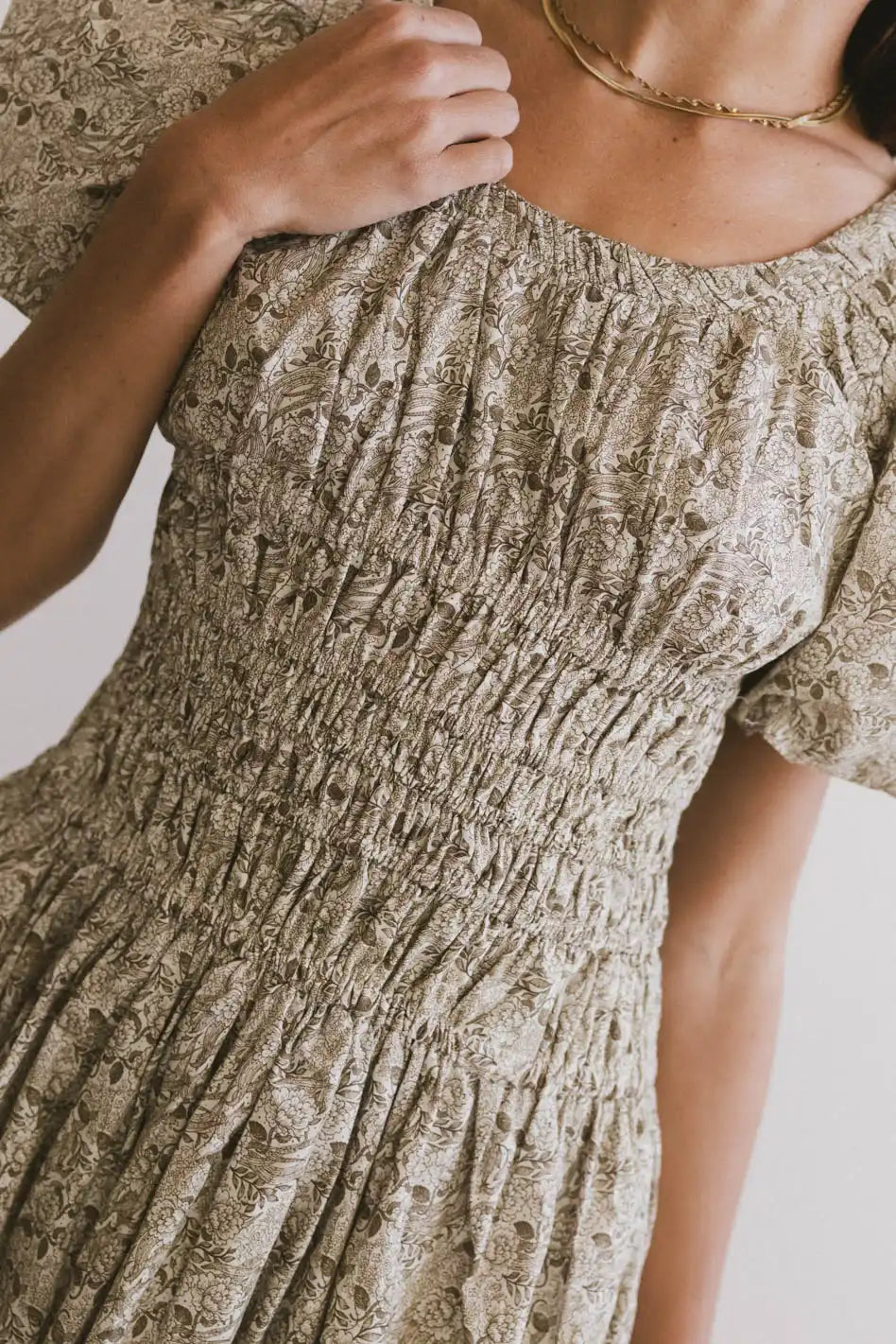 Midi dresses with sheer panels for a touch of allure Lucille Smocked Floral Dress in Olive Midi dresses with sheer panels for a touch of allure Lucille Smocked Floral Dress in Olive
