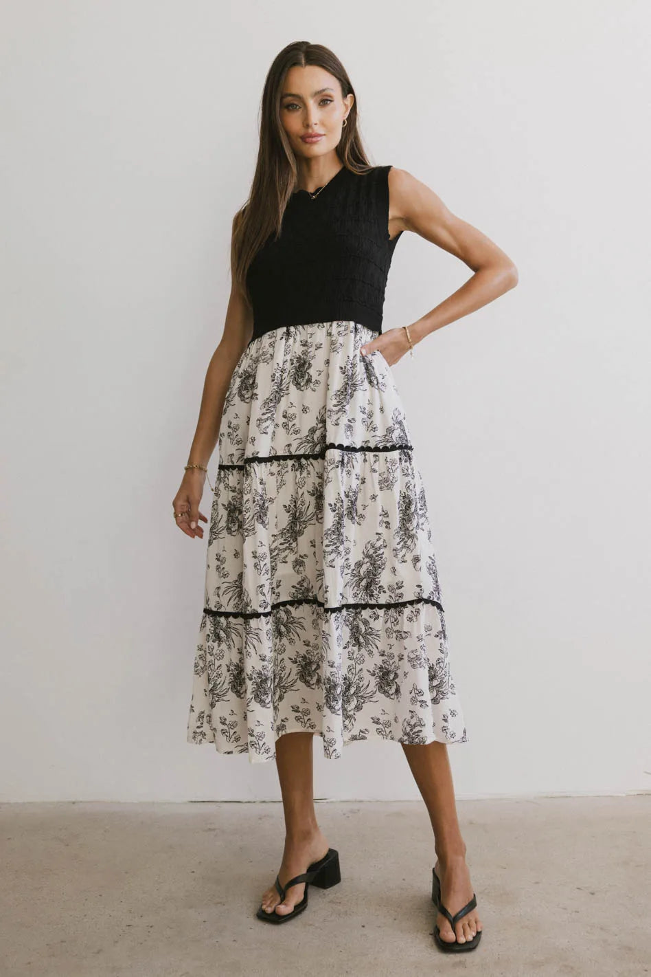 Midi dresses with embroidered accents for a unique and detailed design Cherney Tiered Floral Dress in Black Midi dresses with embroidered accents for a unique and detailed design Cherney Tiered Floral Dress in Black