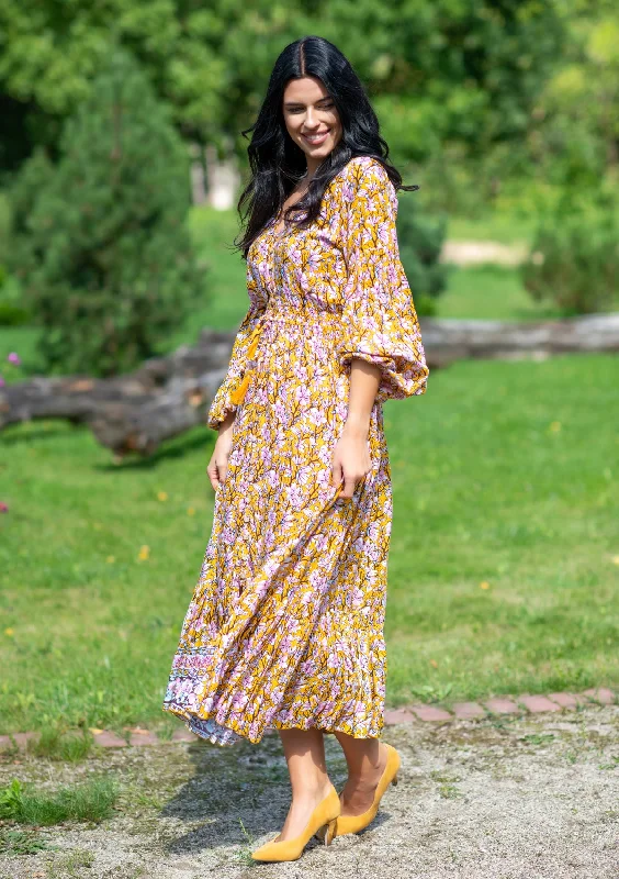 Midi dresses with ruffled bodices for a more pronounced feminine look Simona Orchard Orange Dress