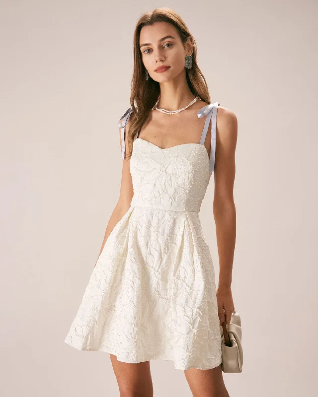 Mini dresses with pocket details for added functionality The Off White Jacquard Tie Strap Mini Dress