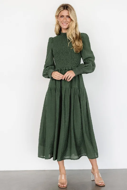 Maxi dresses with a belted empire waist for a more defined and flattering silhouetteDaria Smocked Maxi Dress | Juniper Green Maxi dresses with a belted empire waist for a more defined and flattering silhouetteDaria Smocked Maxi Dress | Juniper Green