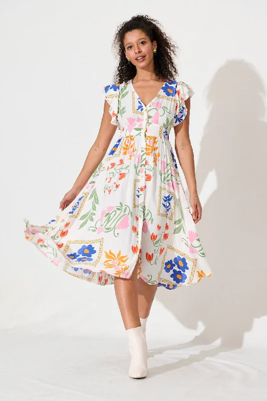 Midi dresses with cold - shoulder cutouts for a trendy styleDaffodil Midi Dress In White With Bright Flowers Midi dresses with cold - shoulder cutouts for a trendy styleDaffodil Midi Dress In White With Bright Flowers