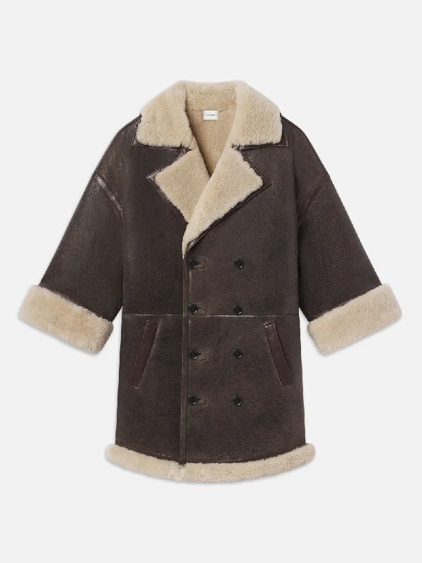 Ripped Denim Top for a Rebellious Fashion StatementShearling Cocoon Coat -- Cardamom Ripped Denim Top for a Rebellious Fashion StatementShearling Cocoon Coat -- Cardamom