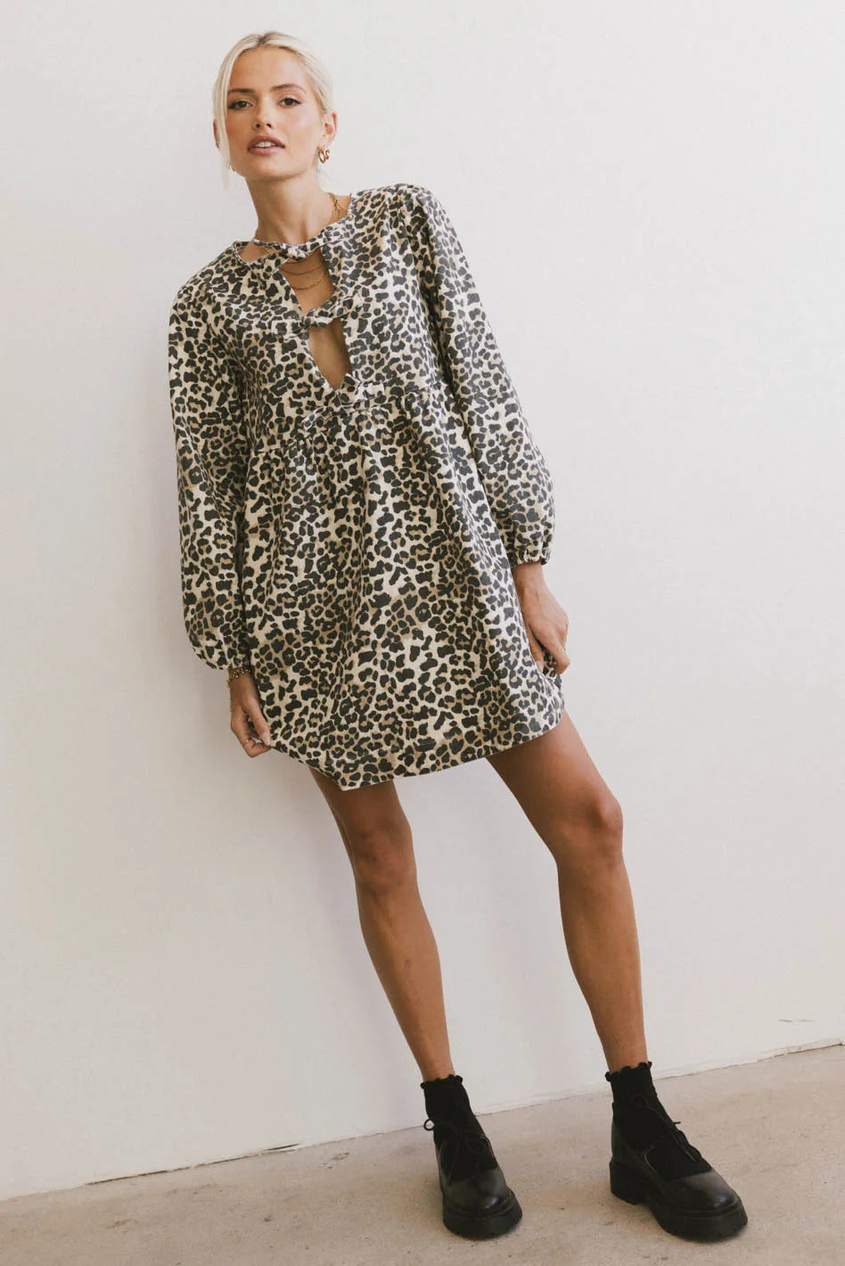 Denim mini dresses with distressed detailsTyler Peplum Mini Dress in Leopard